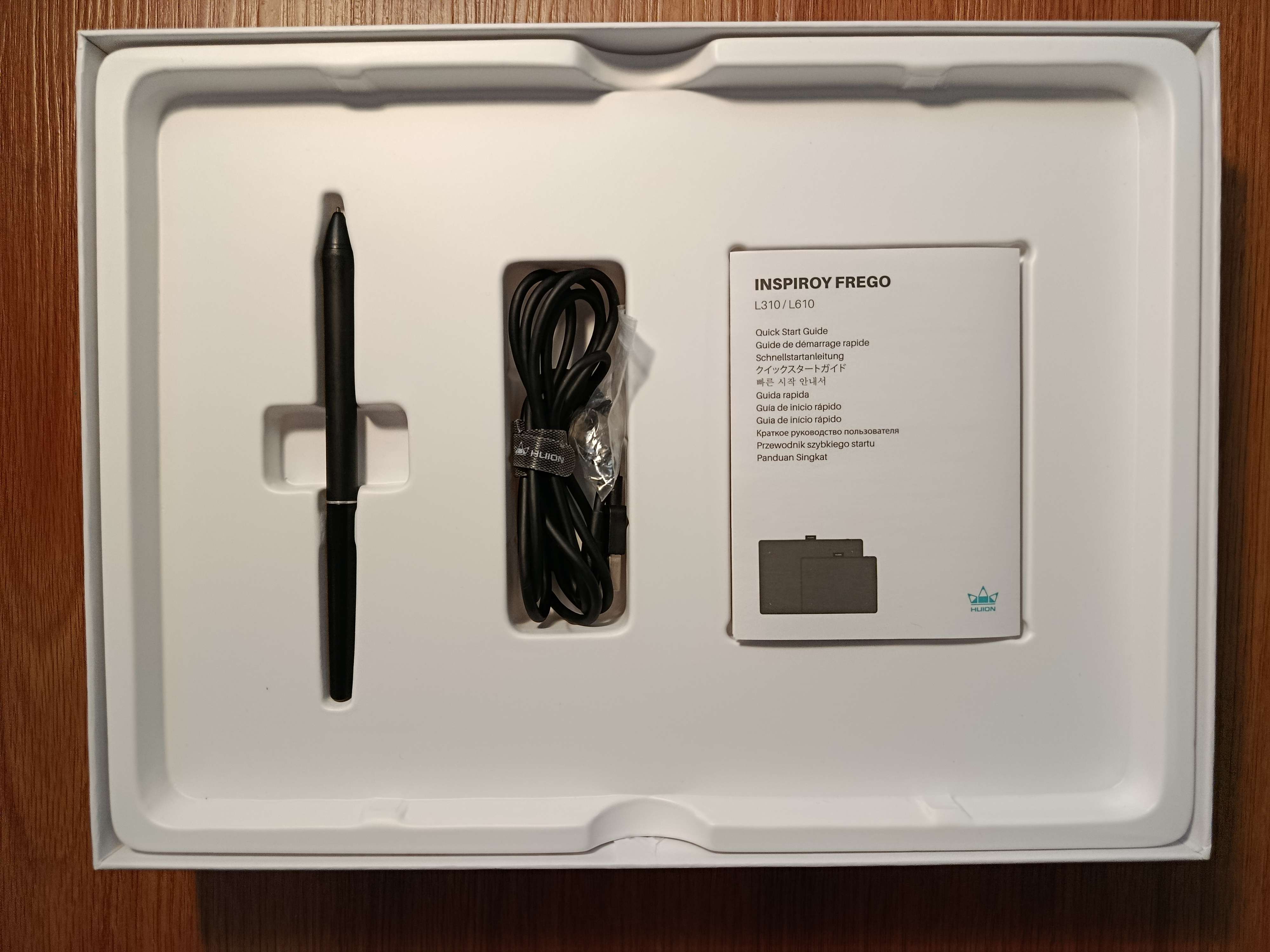 Pen, charging cable, spare nibs, and a booklet